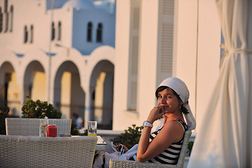 Image showing Greek woman on the streets of Oia, Santorini, Greece