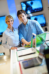 Image showing Young couple in consumer electronics store