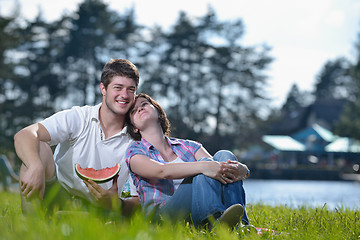 Image showing happy young couple having a picnic outdoor