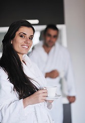 Image showing Young love couple taking fresh morning cup of coffee