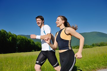 Image showing Young couple jogging