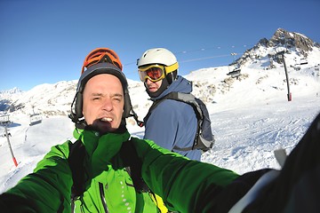 Image showing winter portrait of friends at skiing