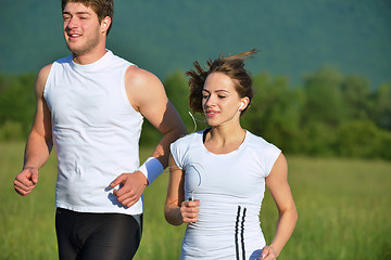 Image showing Young couple jogging at morning