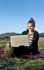 Image showing young teen girl work on laptop outdoor