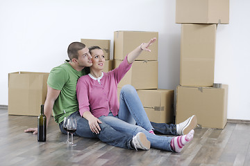 Image showing Young couple moving in new home