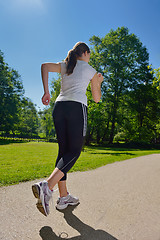 Image showing Young beautiful  woman jogging