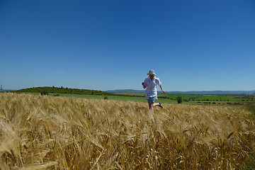 Image showing young woman in wheat field at summer