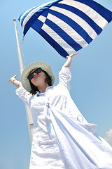 Image showing Greek woman on the streets of Oia, Santorini, Greece