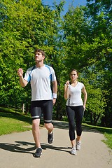 Image showing Young couple jogging