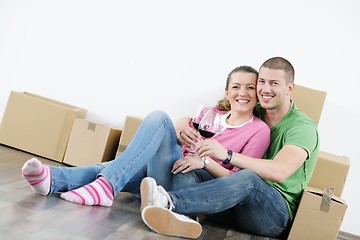 Image showing Young couple moving in new house