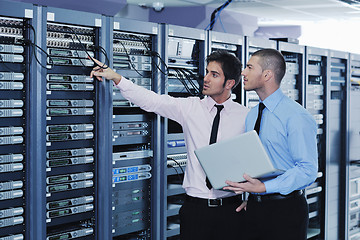 Image showing it enineers in network server room