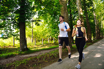 Image showing Young couple jogging