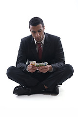 Image showing Business man holding money