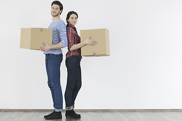 Image showing Young couple moving in new home