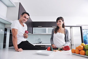 Image showing young couple have fun in modern kitchen