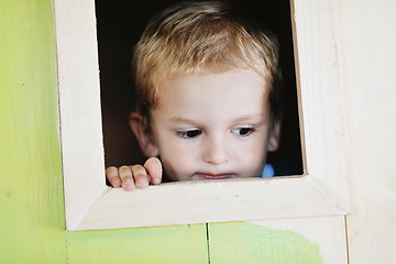 Image showing happy child in a window