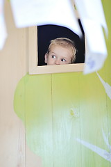 Image showing happy child in a window