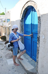 Image showing Greek woman on the streets of Oia, Santorini, Greece