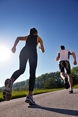 Image showing Young couple jogging