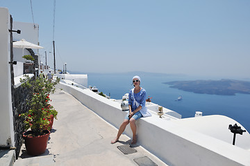 Image showing Greek woman on the streets of Oia, Santorini, Greece