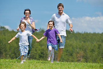 Image showing happy young family have fun outdoors