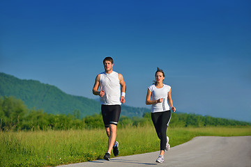 Image showing Young couple jogging at morning