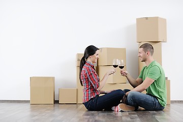 Image showing Young couple moving in new house