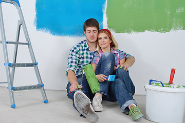 Image showing happy young cople relaxing after painting in new home