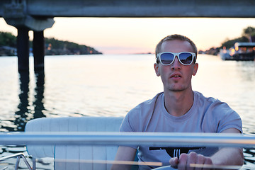 Image showing portrait of happy young man on boat