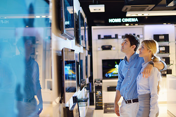 Image showing Young couple in consumer electronics store