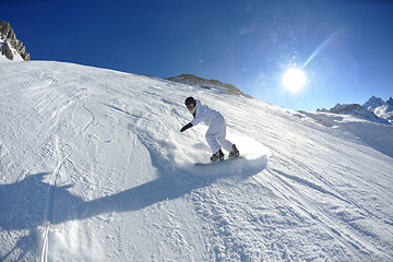 Image showing skiing on fresh snow at winter season at beautiful sunny day