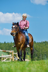 Image showing happy woman  on  horse