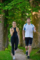 Image showing Young couple jogging