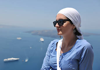 Image showing Greek woman on the streets of Oia, Santorini, Greece