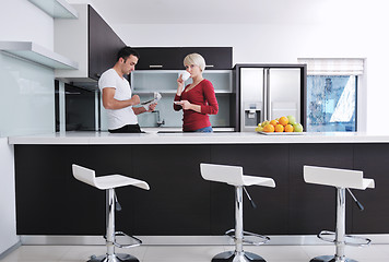 Image showing young couple have fun in modern kitchen