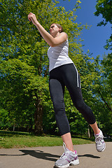 Image showing Young beautiful  woman jogging at morning in park