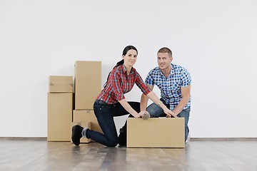 Image showing Young couple moving in new house