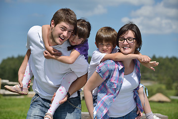 Image showing happy young family have fun outdoors