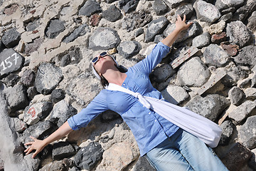 Image showing Greek woman on the streets of Oia, Santorini, Greece