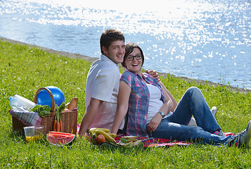 Image showing happy young couple having a picnic outdoor