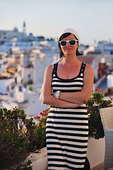 Image showing Greek woman on the streets of Oia, Santorini, Greece