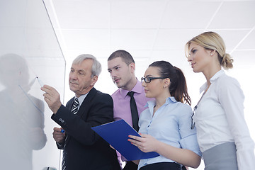 Image showing Senior business man giving a presentation