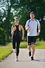 Image showing Young couple jogging at morning