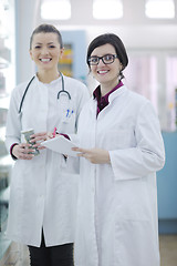 Image showing team of pharmacist chemist woman  in pharmacy drugstore