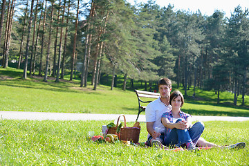 Image showing happy young couple having a picnic outdoor