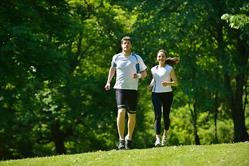 Image showing Young couple jogging