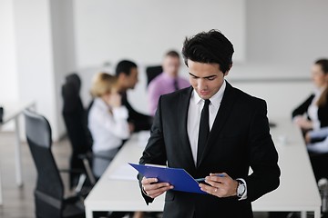 Image showing young business man at meeting