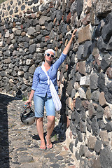 Image showing Greek woman on the streets of Oia, Santorini, Greece