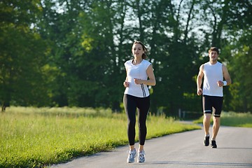 Image showing Young couple jogging at morning