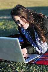 Image showing young teen girl work on laptop outdoor